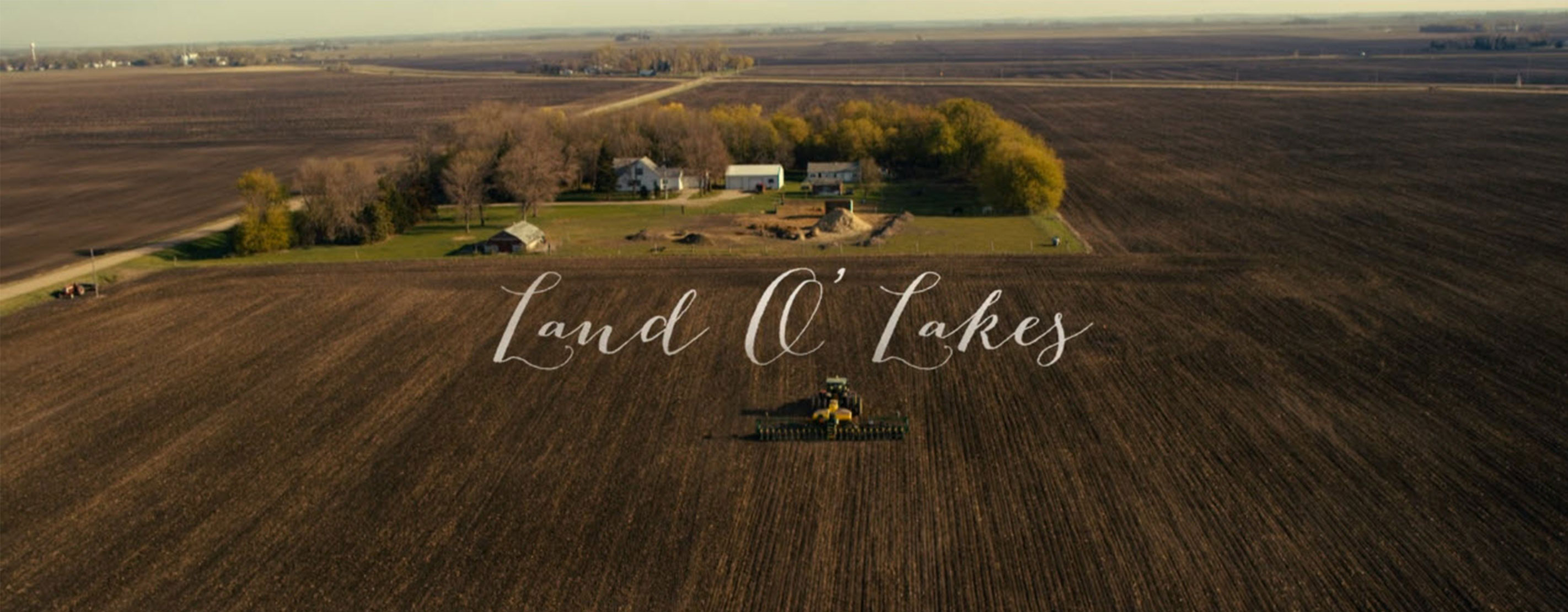 An Aerial View Of A Large Farm With The Text Land O