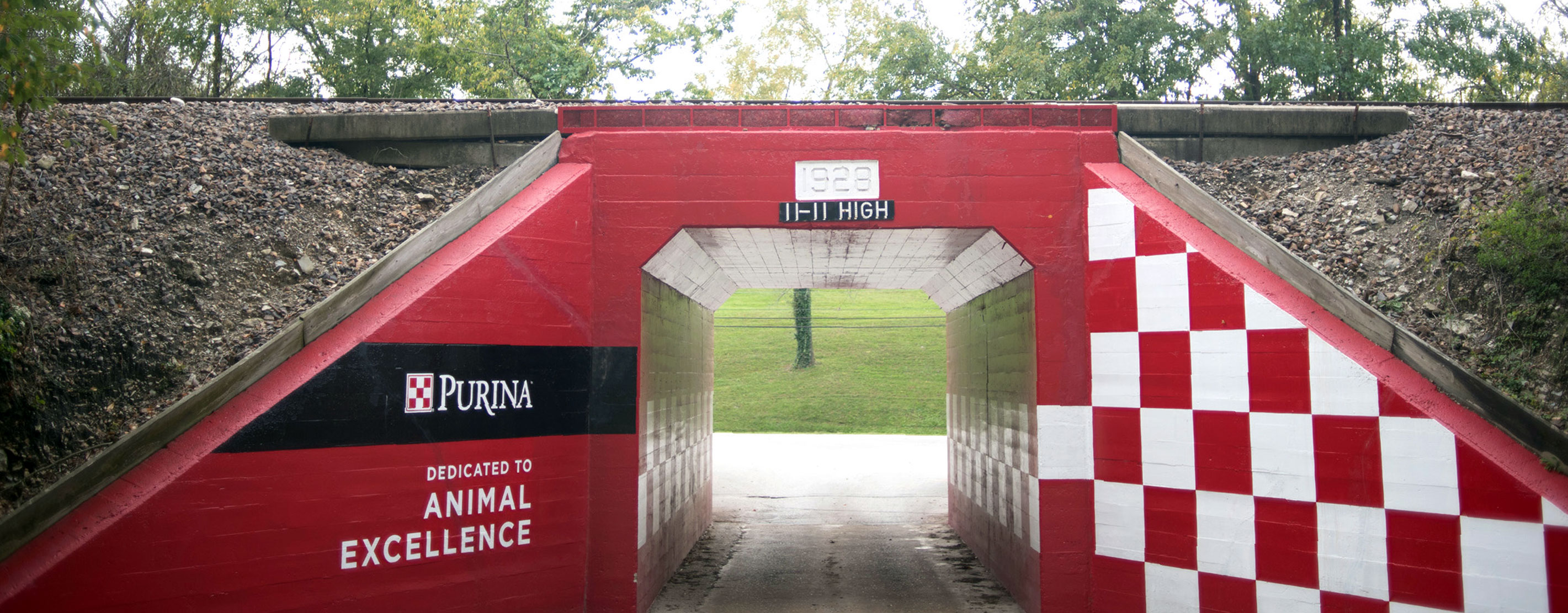 Entrance To "The Farm" With Prominent Purina Checkerboard On A Wall