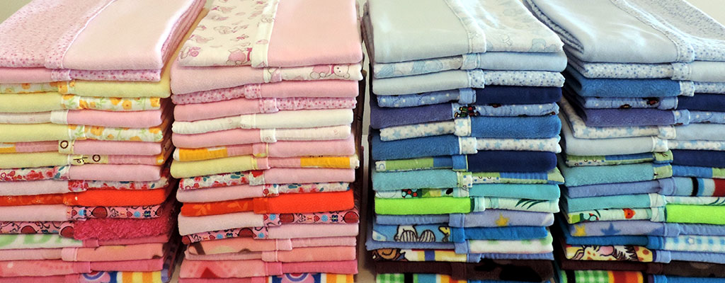 Stacks Of Colorful Baby Blankets 